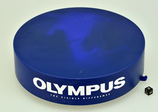 Olympus rotative stand for camera display